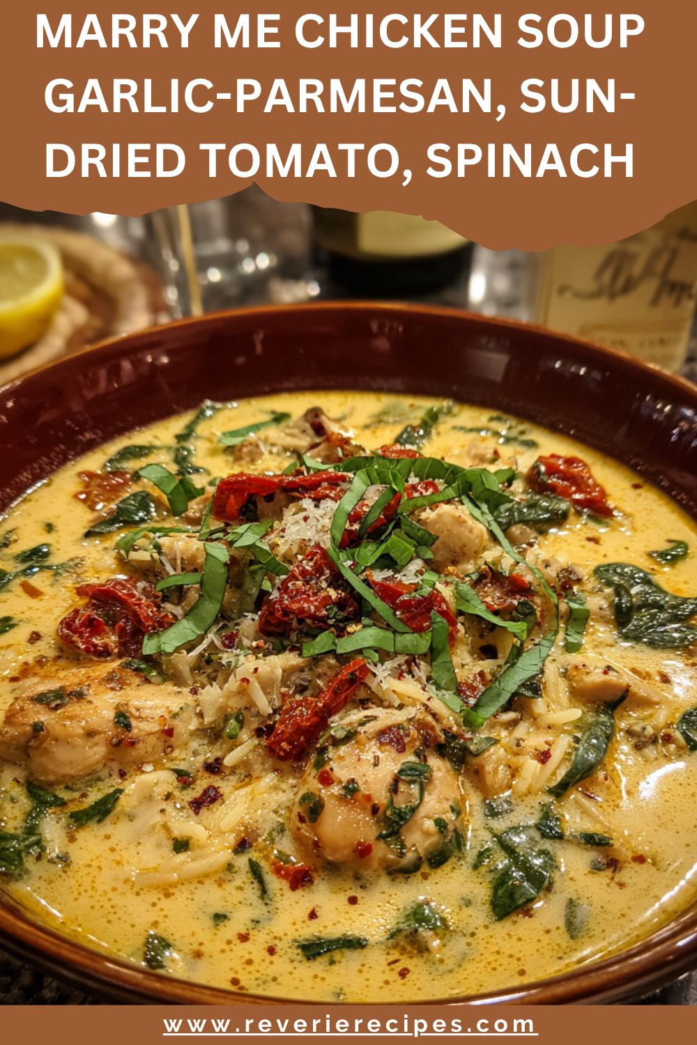 Creamy “Marry Me” chicken soup with sun-dried tomatoes and spinach, garnished with Parmesan and fresh basil.