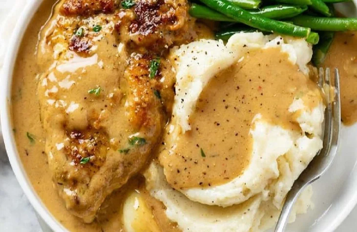 Creamy garlic chicken with herbs served on a plate