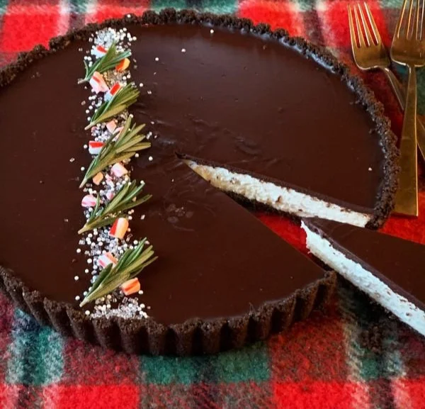 Dark Chocolate Peppermint Mousse Tart topped with mint leaves