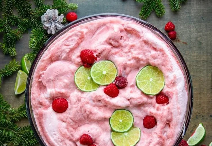 Colorful Sherbet Christmas Punch served in festive glasses for holiday celebrations.
