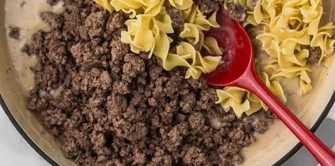 30-minute ground beef stroganoff served in a bowl with fresh herbs