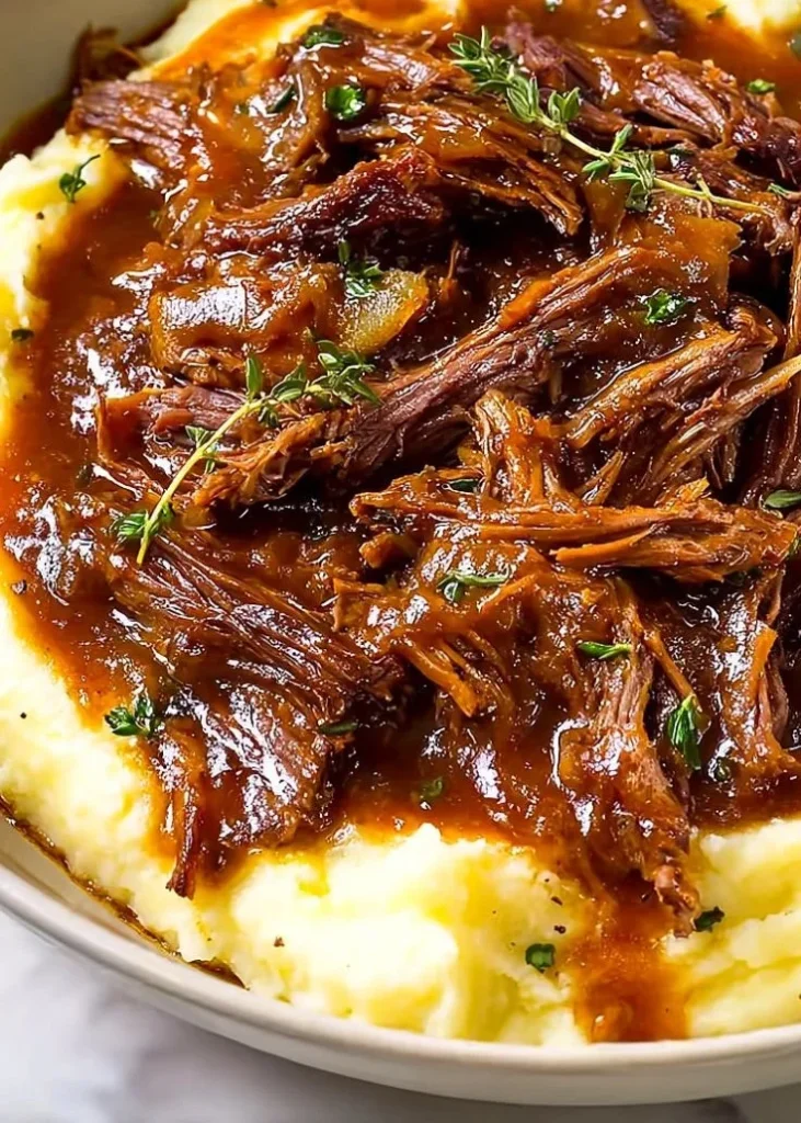 Juicy French Onion Pot Roast with melted cheese and rich onion gravy