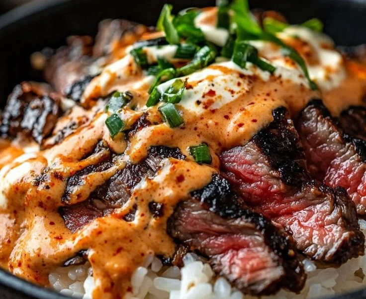 Korean BBQ steak rice bowl with marinated beef and colorful vegetables