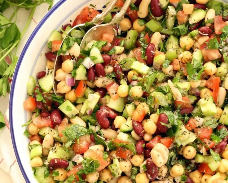 Colorful Mediterranean Bean Salad with fresh vegetables and herbs