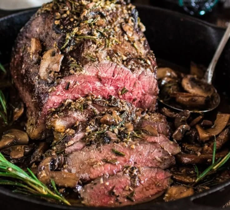 Delicious Rosemary and Garlic Roast Beef ready to serve