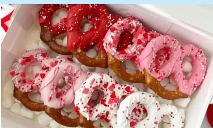 Chocolate dipped Valentine pretzels decorated for a romantic celebration