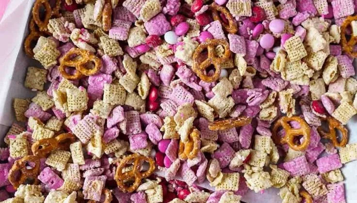 Valentine's Day Puppy Chow Chex Mix in a festive bowl