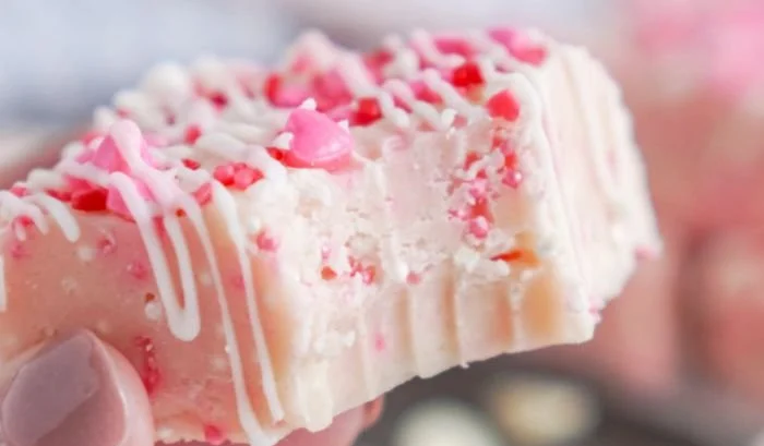Delicious Valentine's Day sugar cookie fudge on a decorative plate.