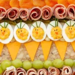 Colorful Easter charcuterie boards filled with seasonal snacks and decorations.